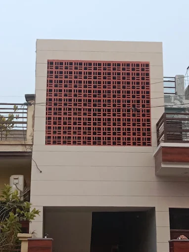 Terracotta jali facade installed on a house in Jaipur
